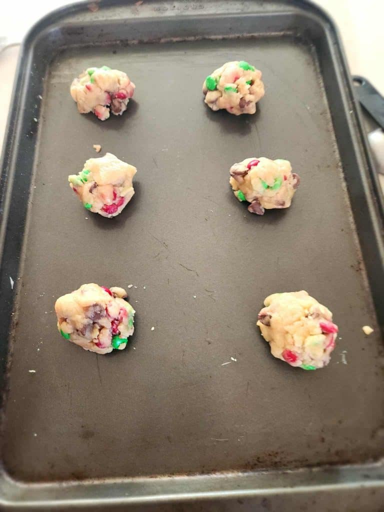 round dough balls of Christmas Cookies in a jar
