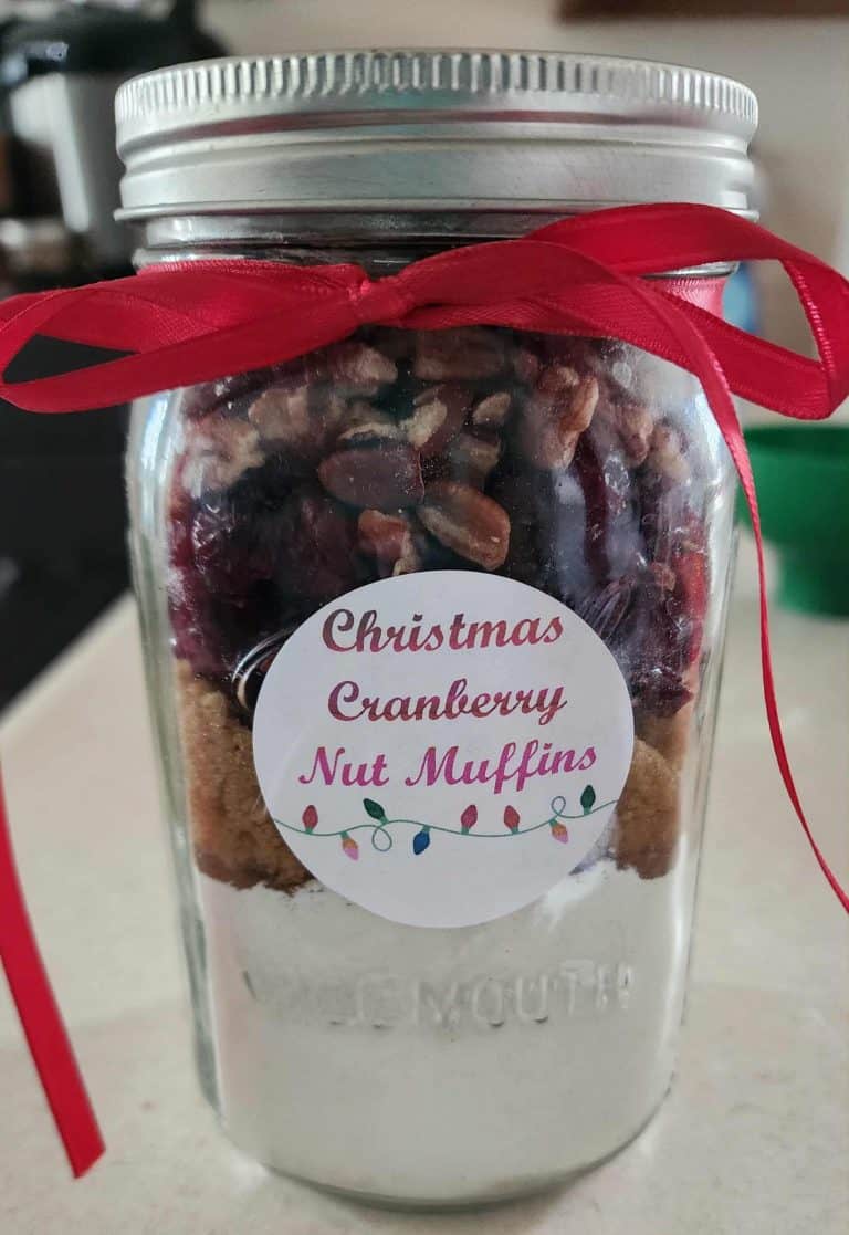 Jar of Christmas muffin mix with a bow and a label