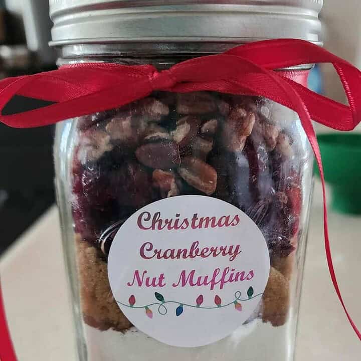 Jar of Christmas muffin mix with a bow and a label