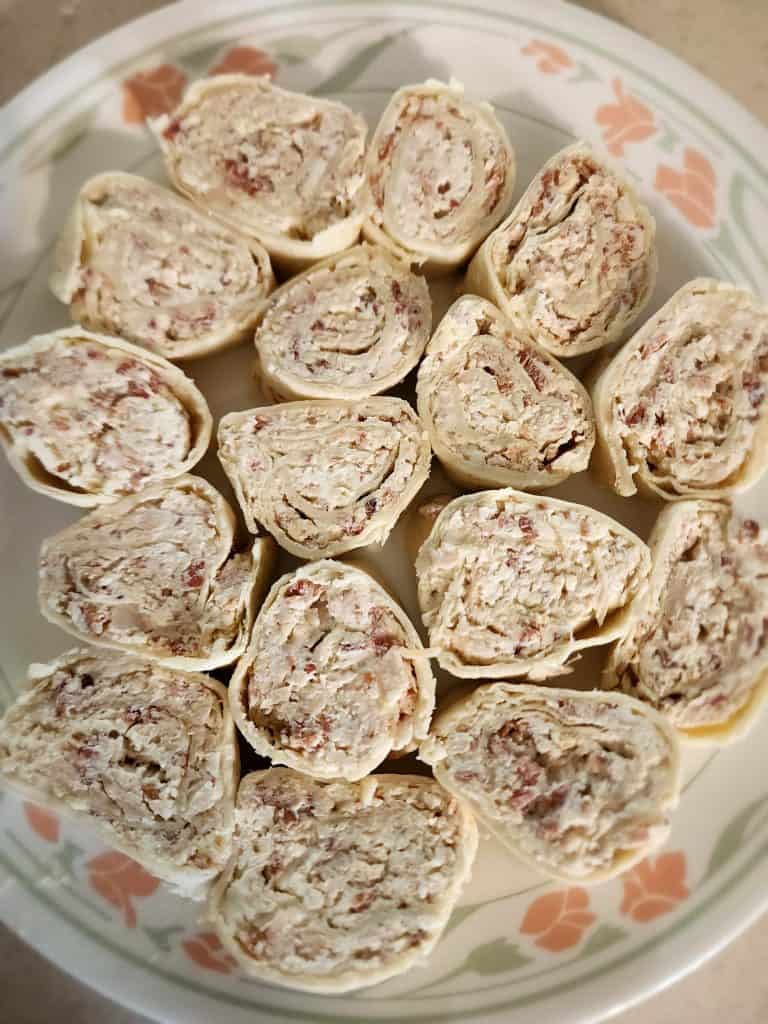 caesar chicken roll ups on a plate