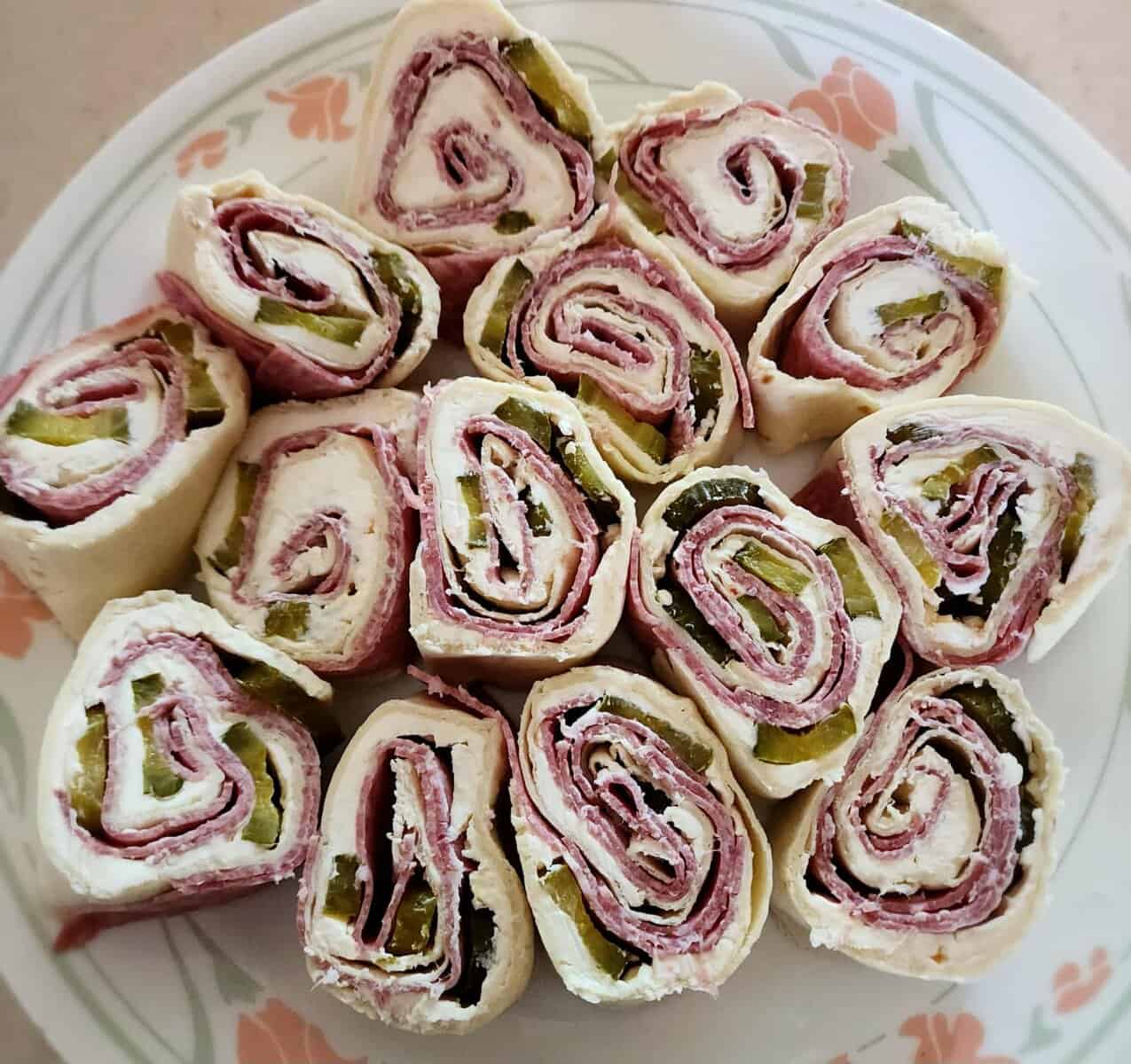 salami pickle roll ups on a plate