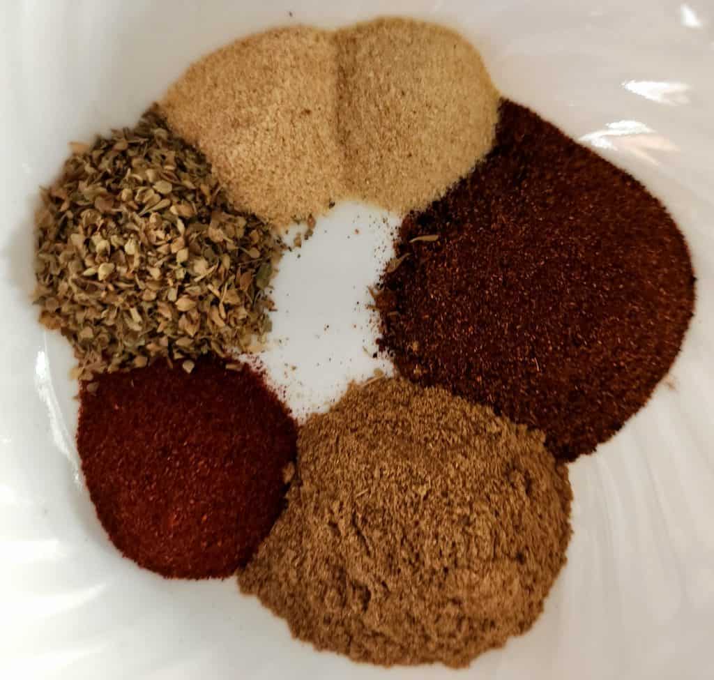 chili seasoning ingredients separated out in a bowl