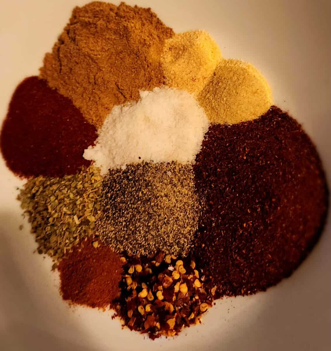 taco seasoning ingredients separated in a bowl