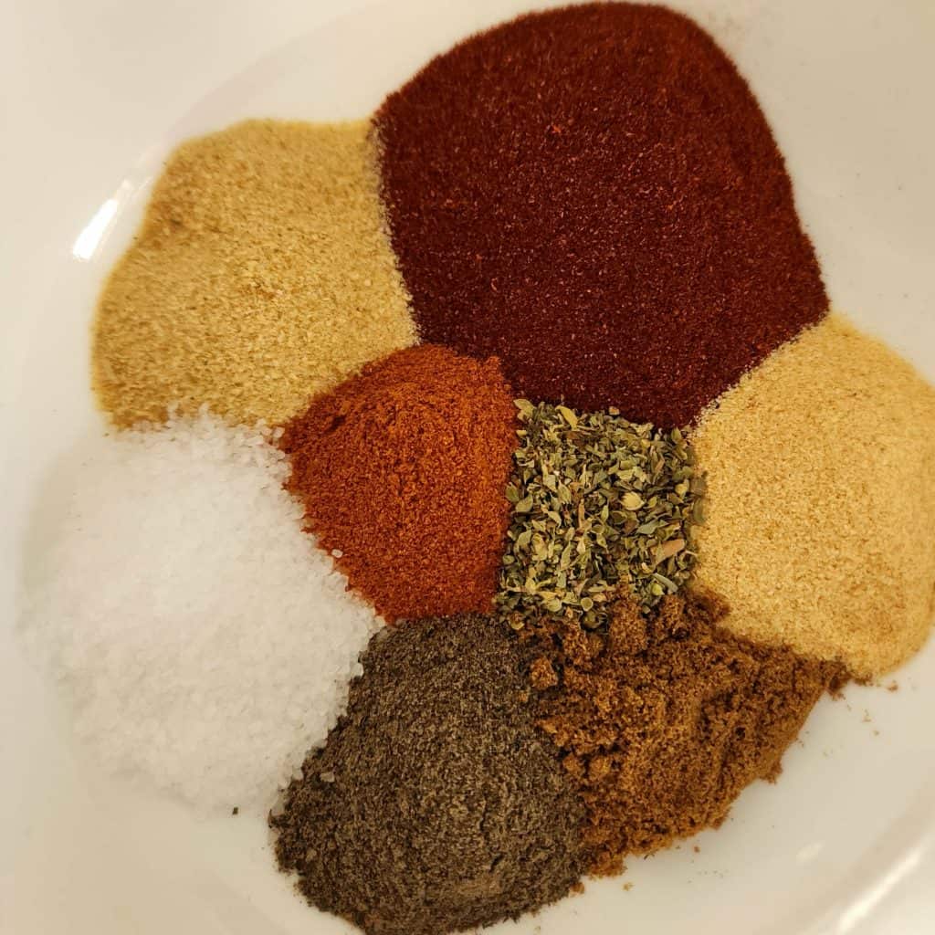 Blackened seasoning ingredients separate in a bowl