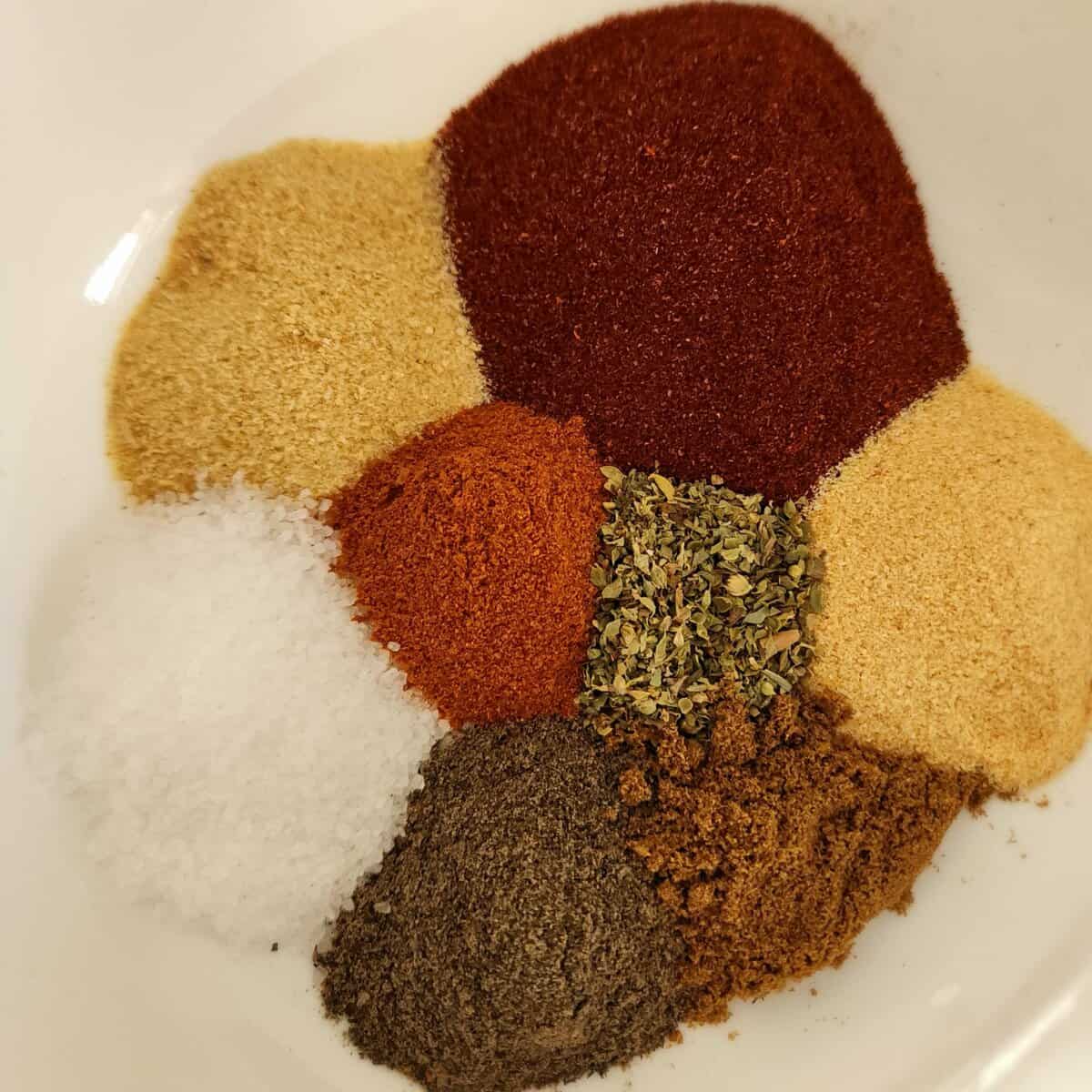 Blackened seasoning ingredients separate in a bowl