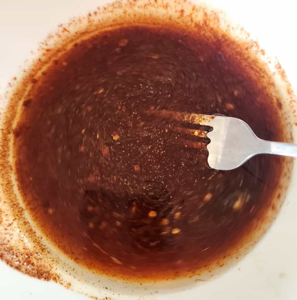 whisking the fajita marinade ingredients