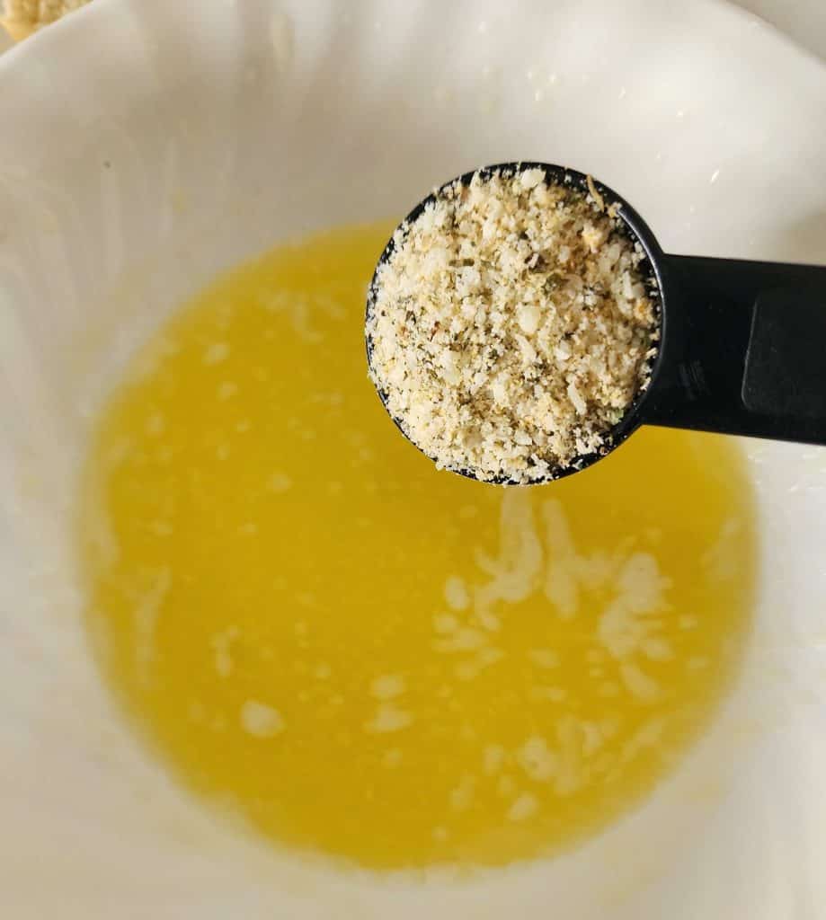 adding seasoning to melted butter