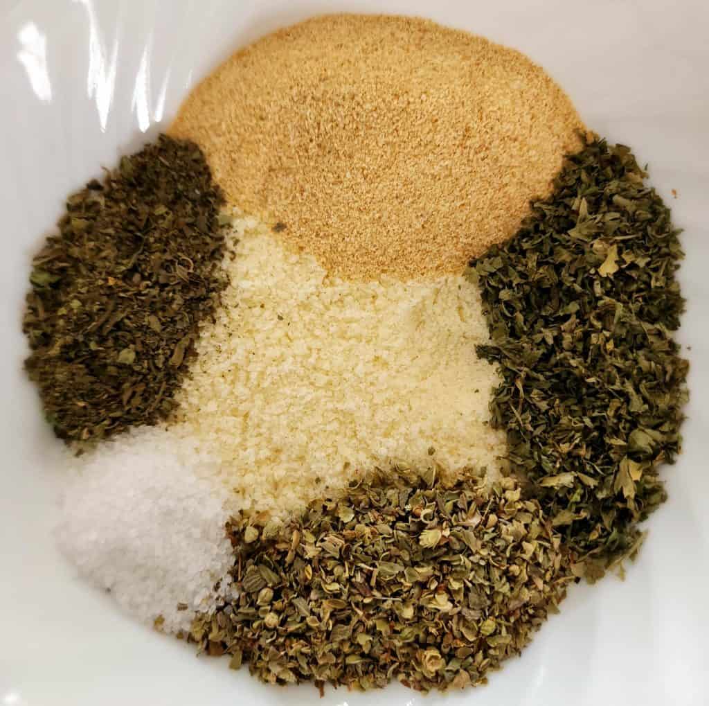 greek seasoning ingredients separate in a bowl