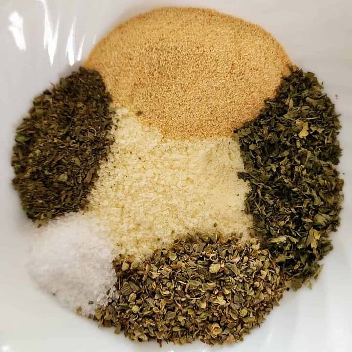 greek seasoning ingredients separate in a bowl