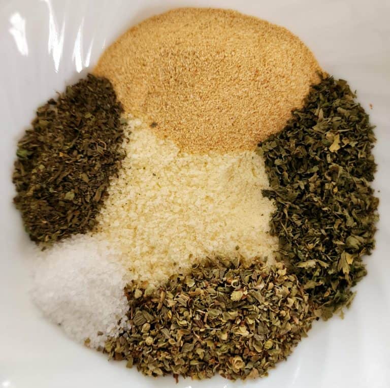 greek seasoning ingredients separate in a bowl