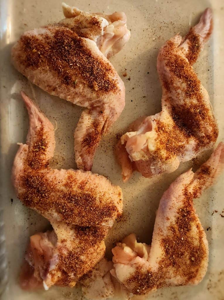 chicken wings sprinkled with homemade chicken wing seasoning