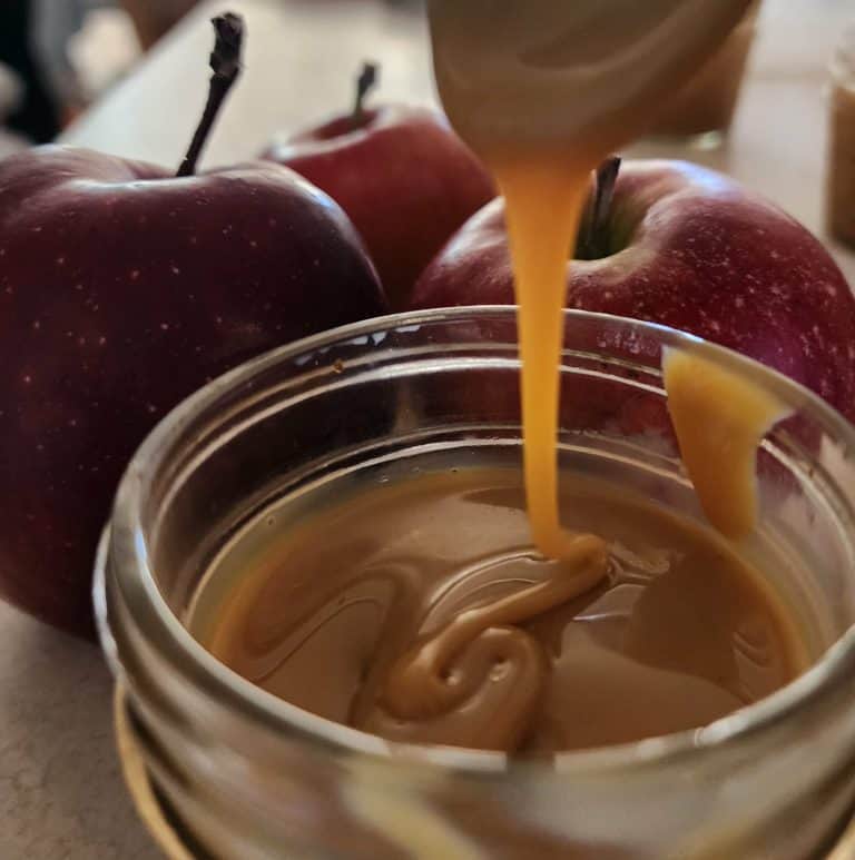 caramel dripping from spoon for slow cooker caramel