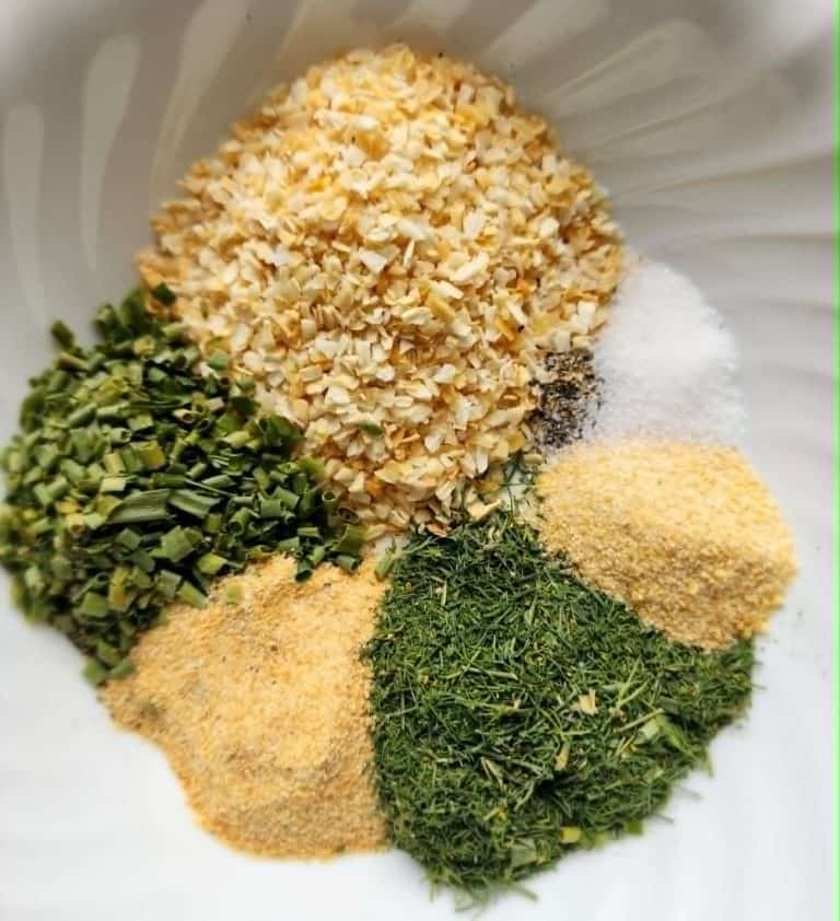 French onion dip mix ingredients separated in a bowl