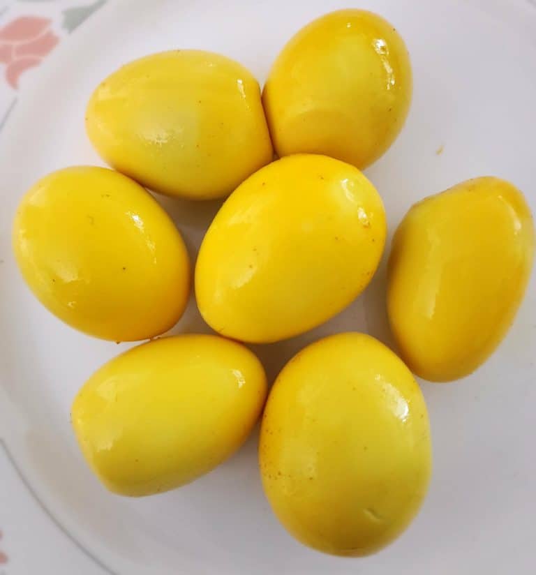 TUMERIC GINGER PICKLED EGGS ON A PLATE