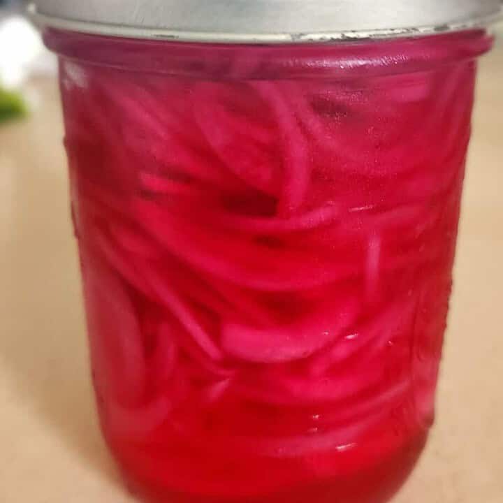 quick pickled red onions in a jar
