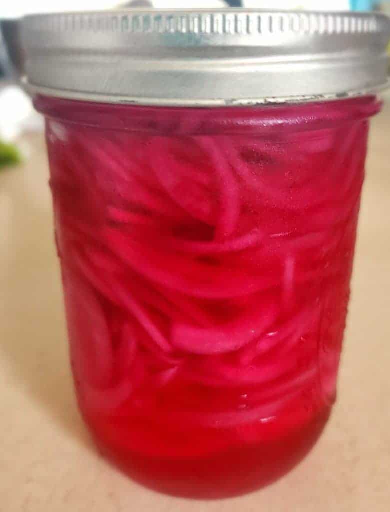 quick pickled red onions in a jar