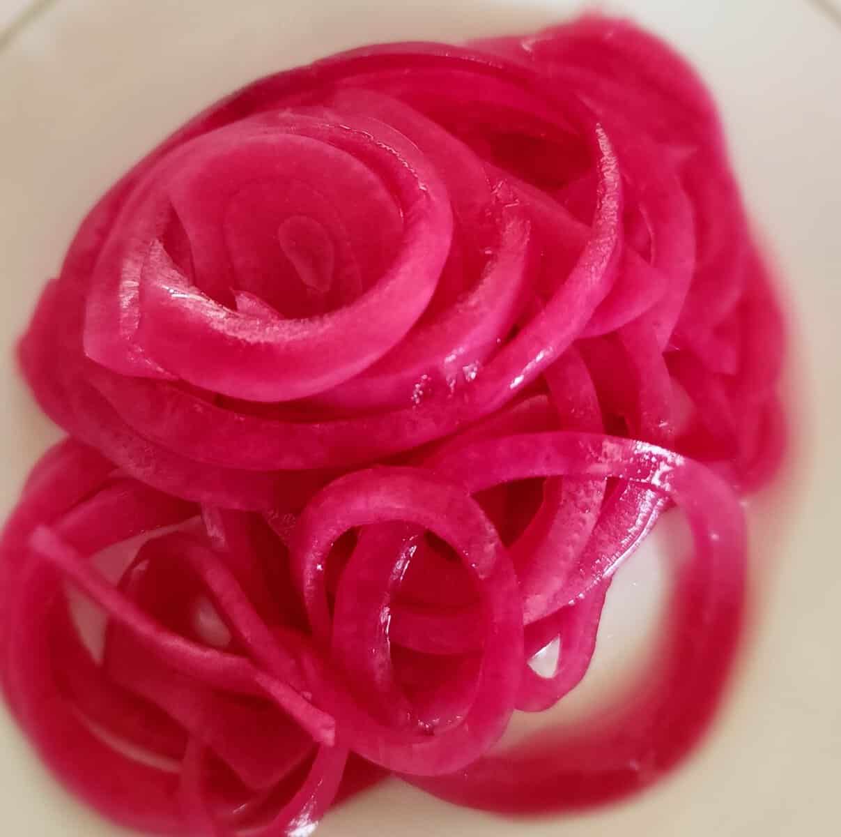 pickled red onions on a plate